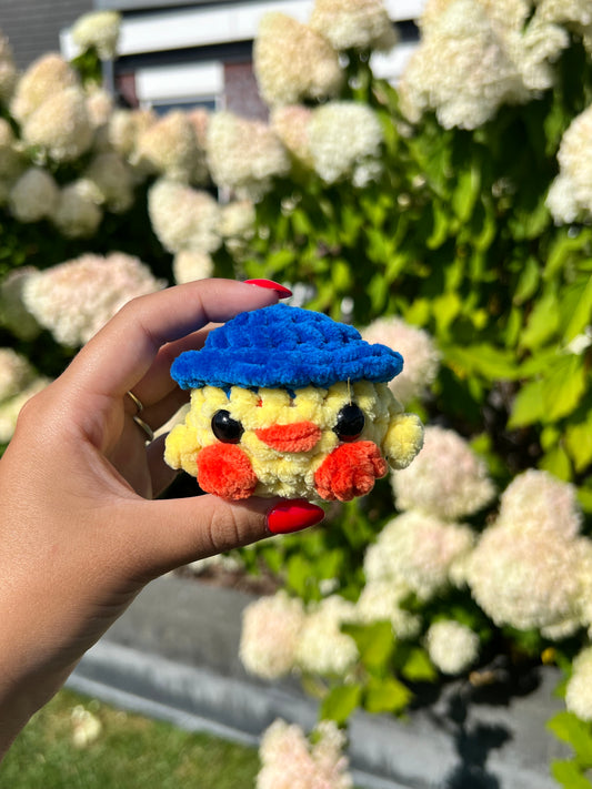 kuiken met blauwe hoed