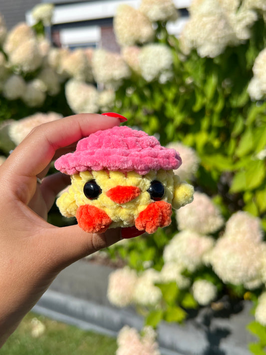 kuiken met roze hoed