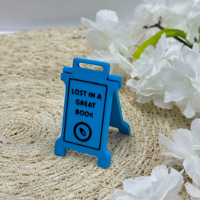 'lost in a great book' sign