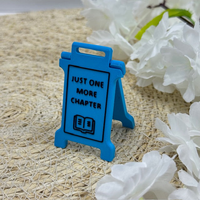 'just one more chapter' sign