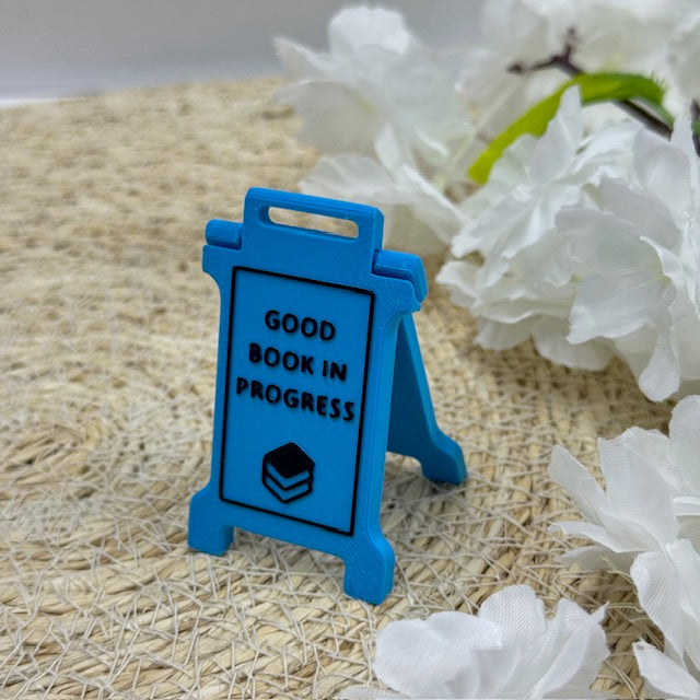 'good book in progress' sign